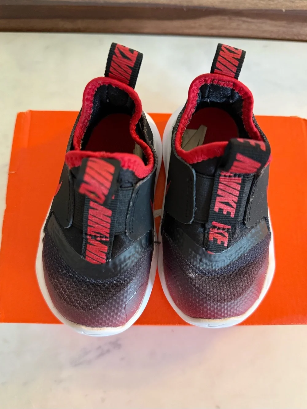Nike Kids Black and Red Slip-On Sneakers with White Sole